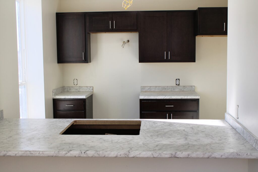 Finished Kitchen at 45 Dougherty project displaying sink, counter and shelving.